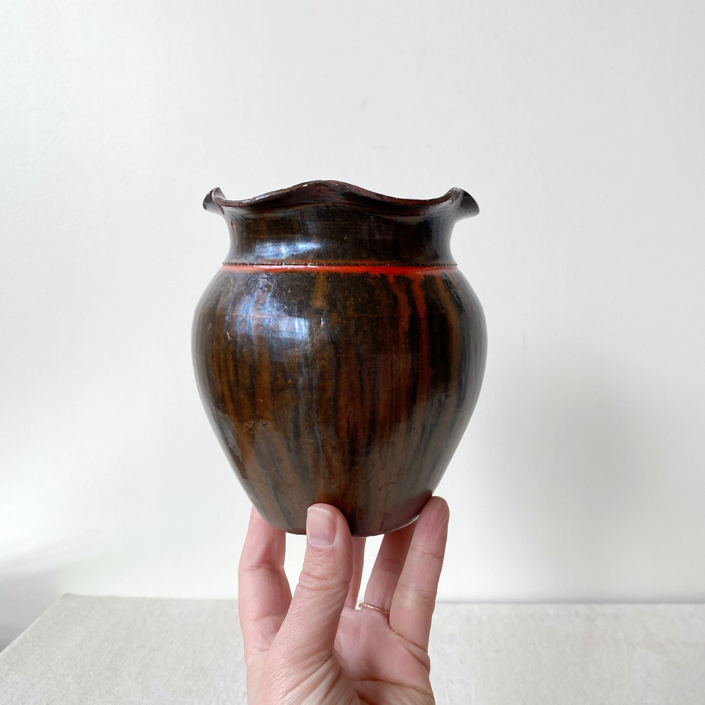 Vintage Black and Red Pottery Vessel with Ruffle Lip