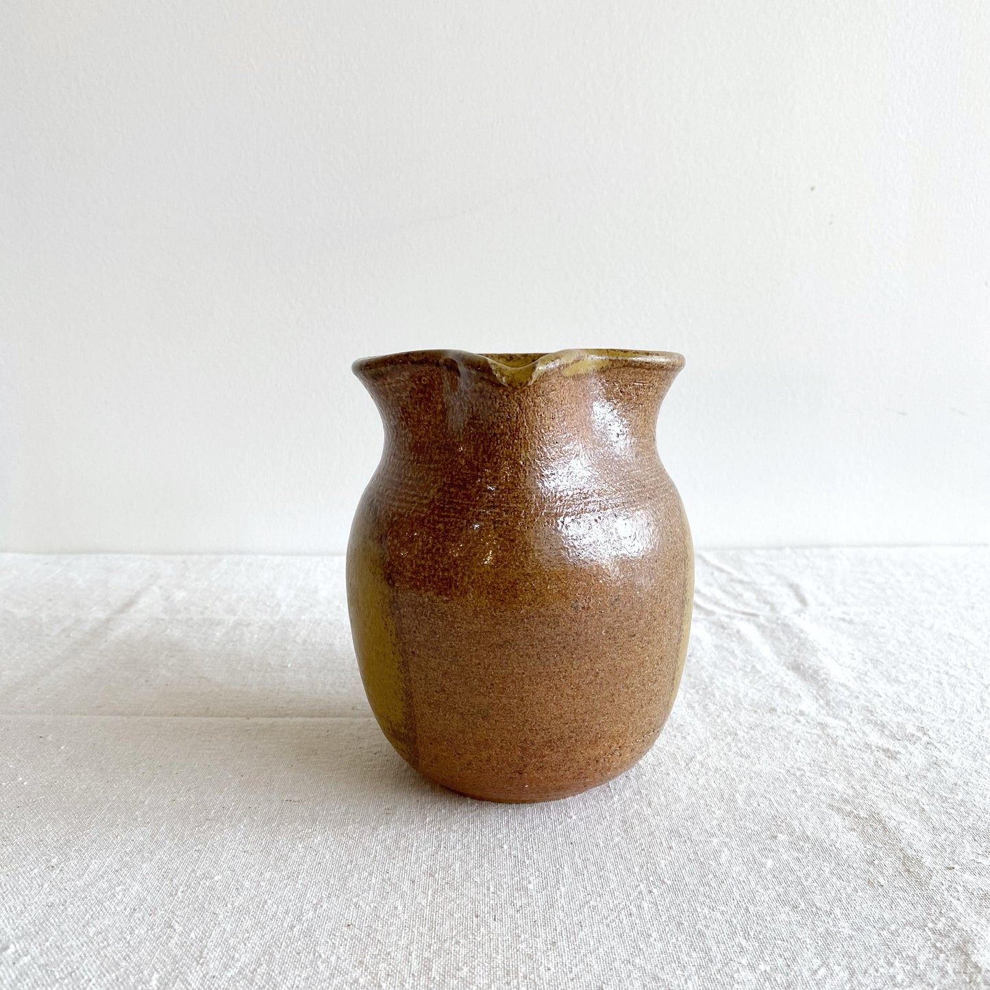 Handcrafted Pottery Pitcher with Yellow Detail