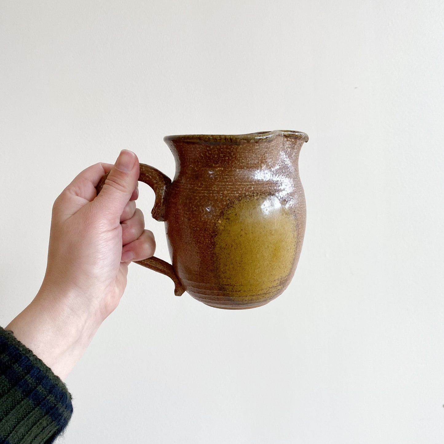 Handcrafted Pottery Pitcher with Yellow Detail