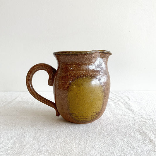 Handcrafted Pottery Pitcher with Yellow Detail