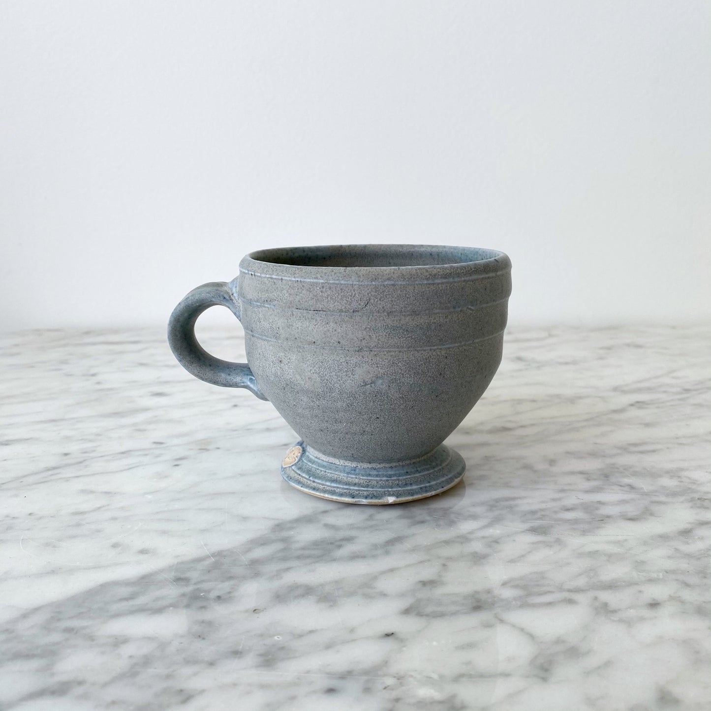 Handcrafted Footed Pottery Mug