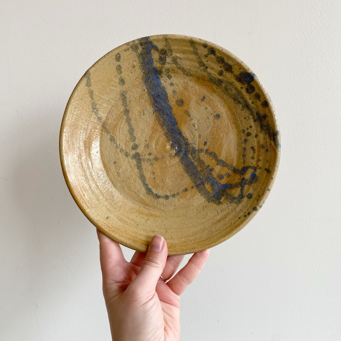 Vintage Pottery Plate with Blue Splatter Design