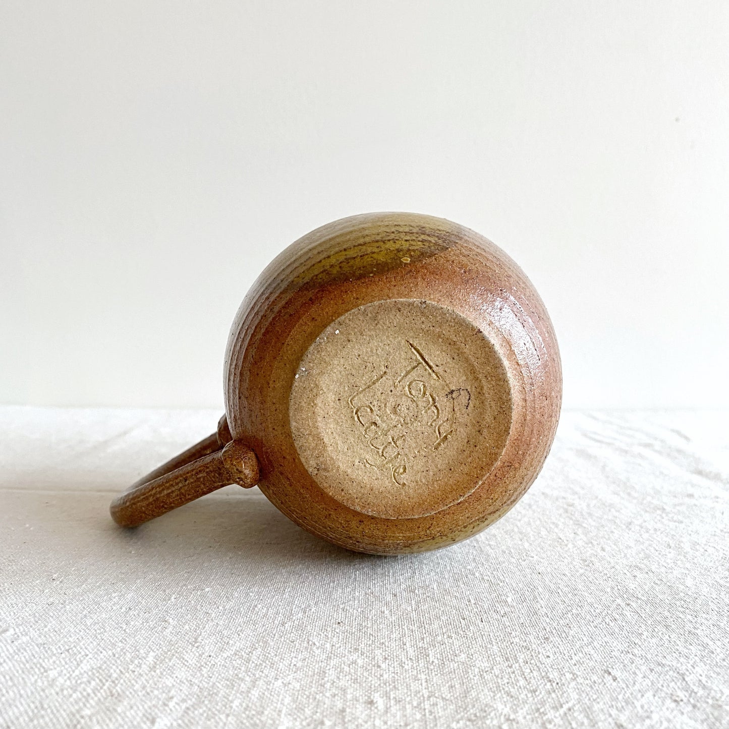 Handcrafted Pottery Pitcher with Yellow Detail