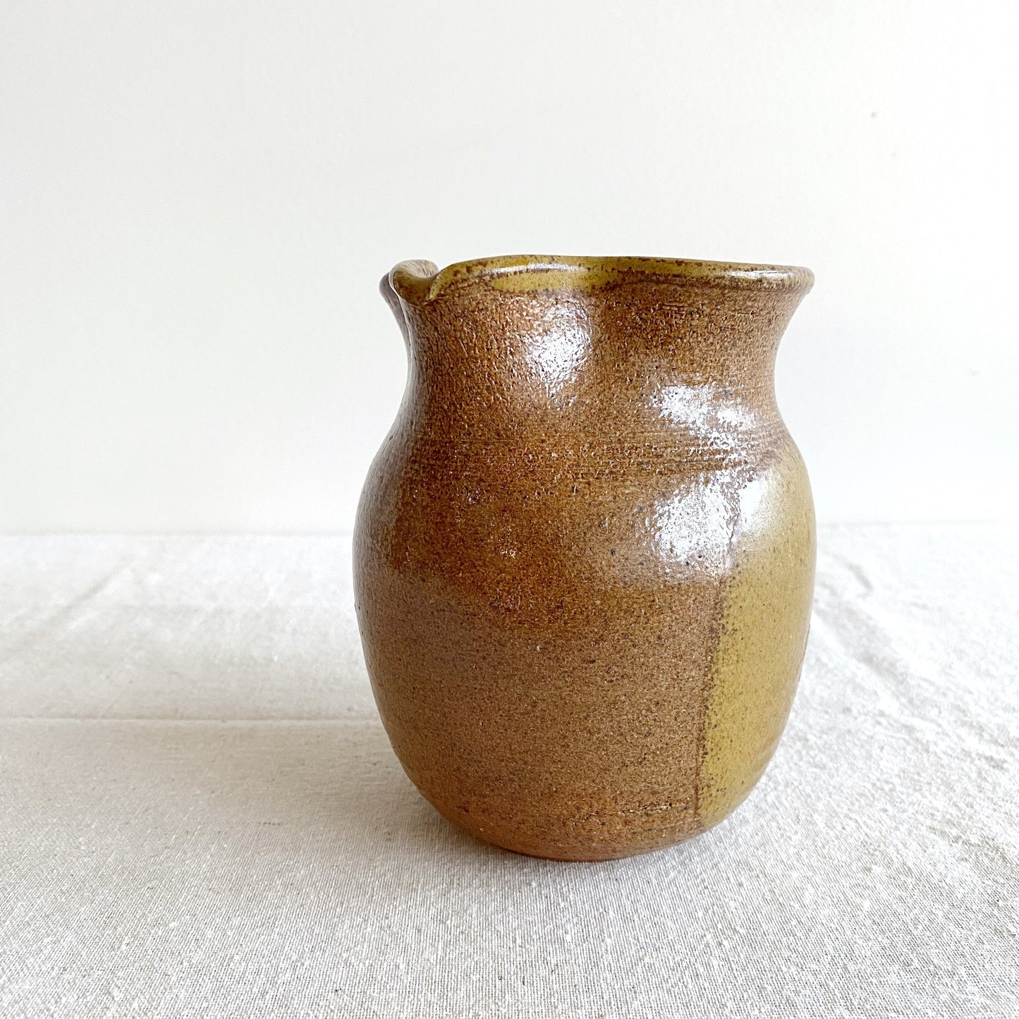 Handcrafted Pottery Pitcher with Yellow Detail