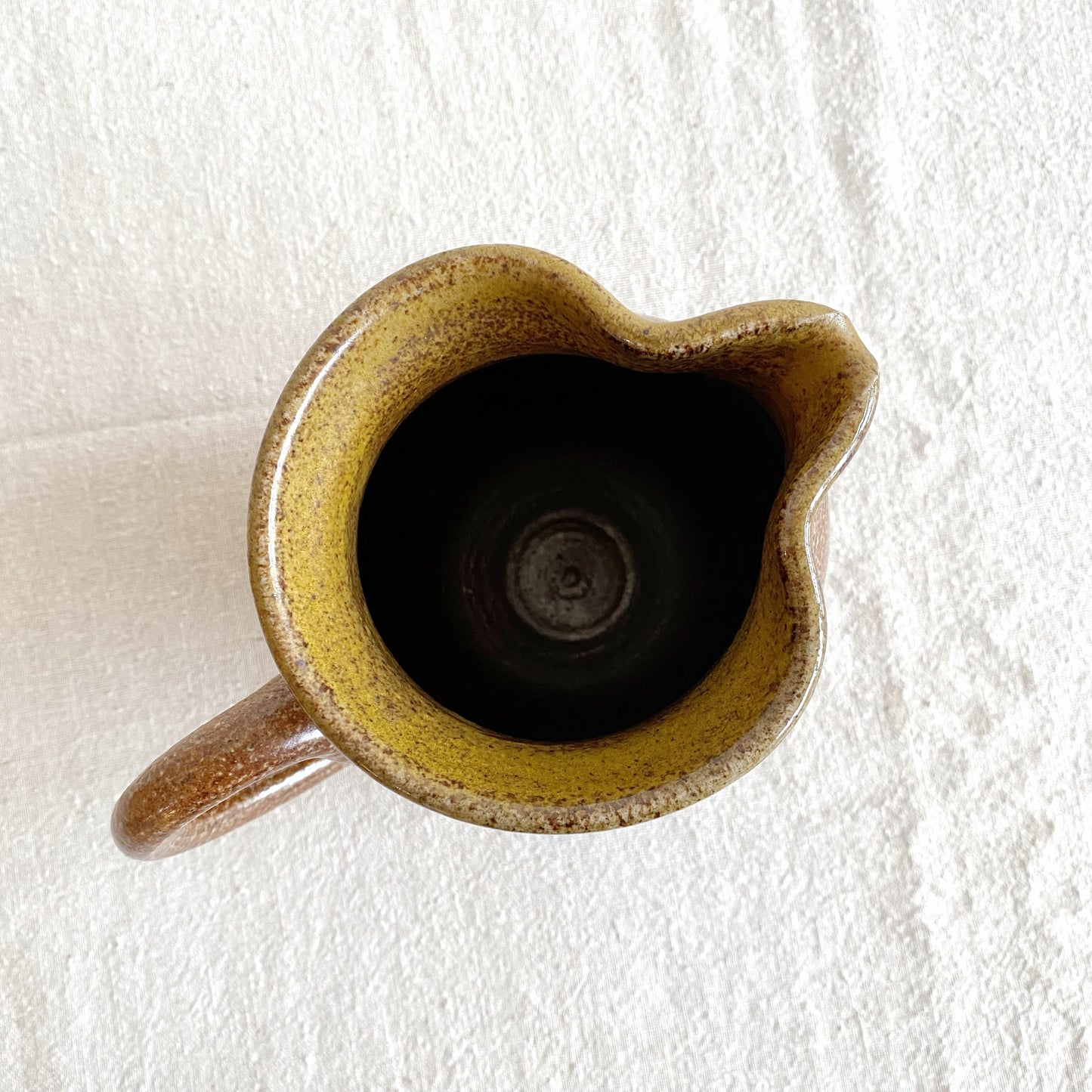 Handcrafted Pottery Pitcher with Yellow Detail